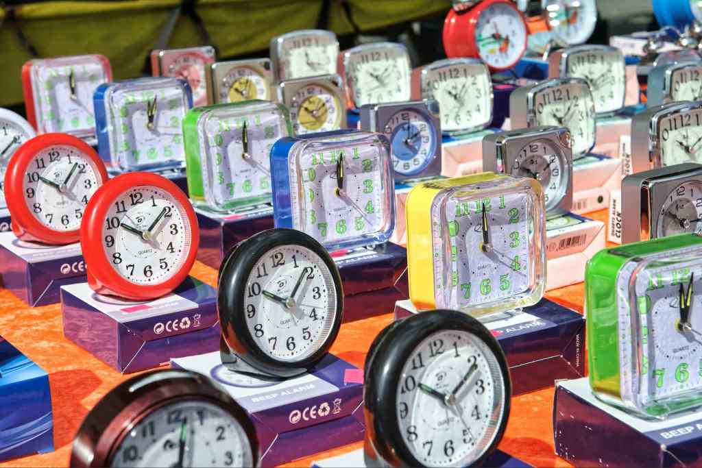 table filled with small colorful clock timers