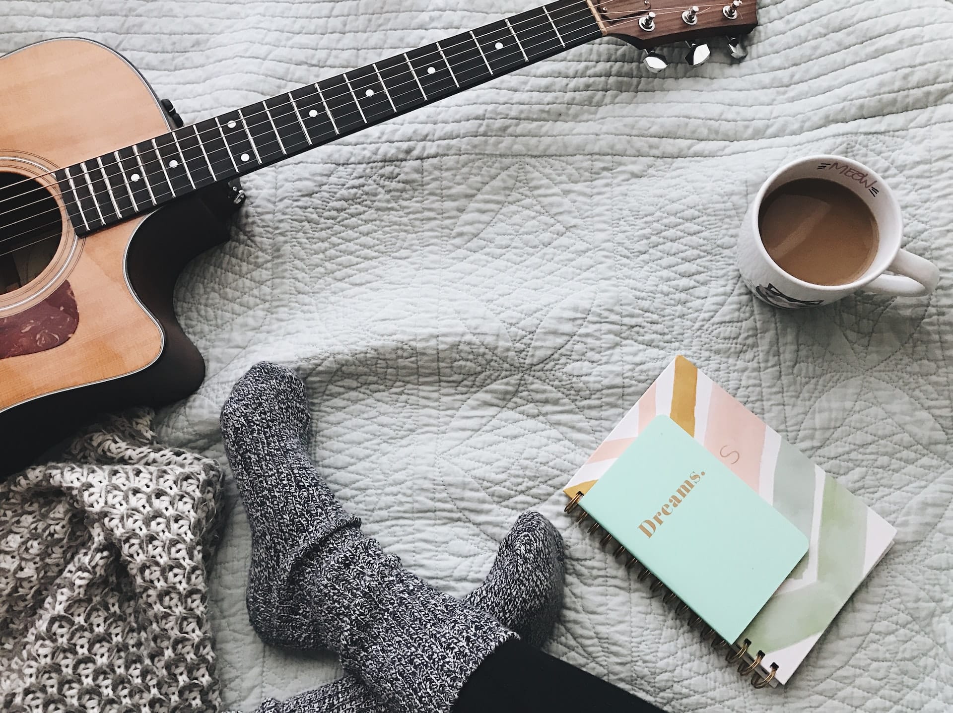 evening routine cosy music guitar and journals on bed