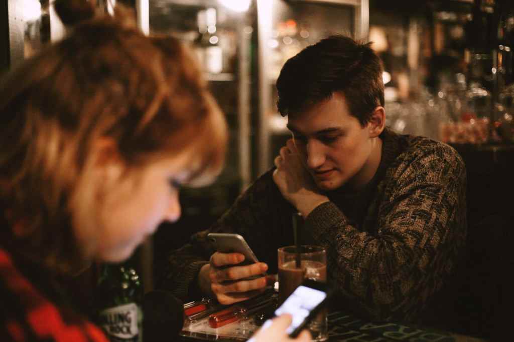 couple looking at phones