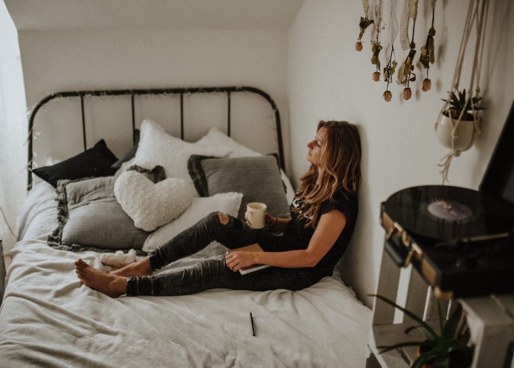 Woman relaxing and taking a break with a cup of coffee