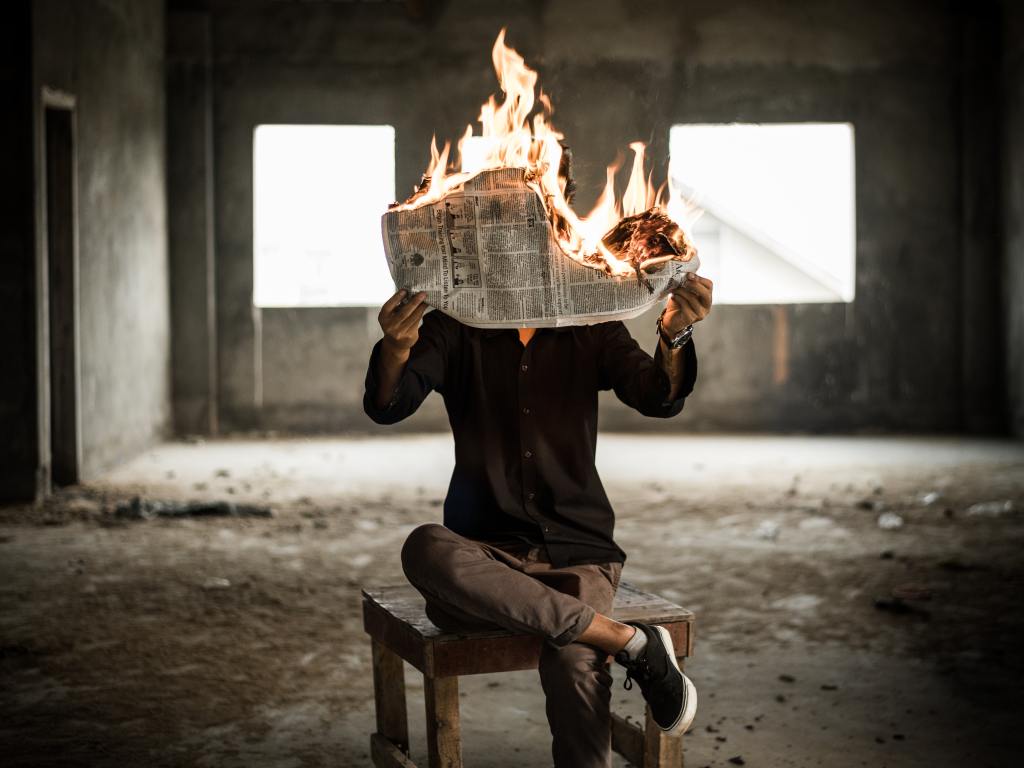 burning newspaper