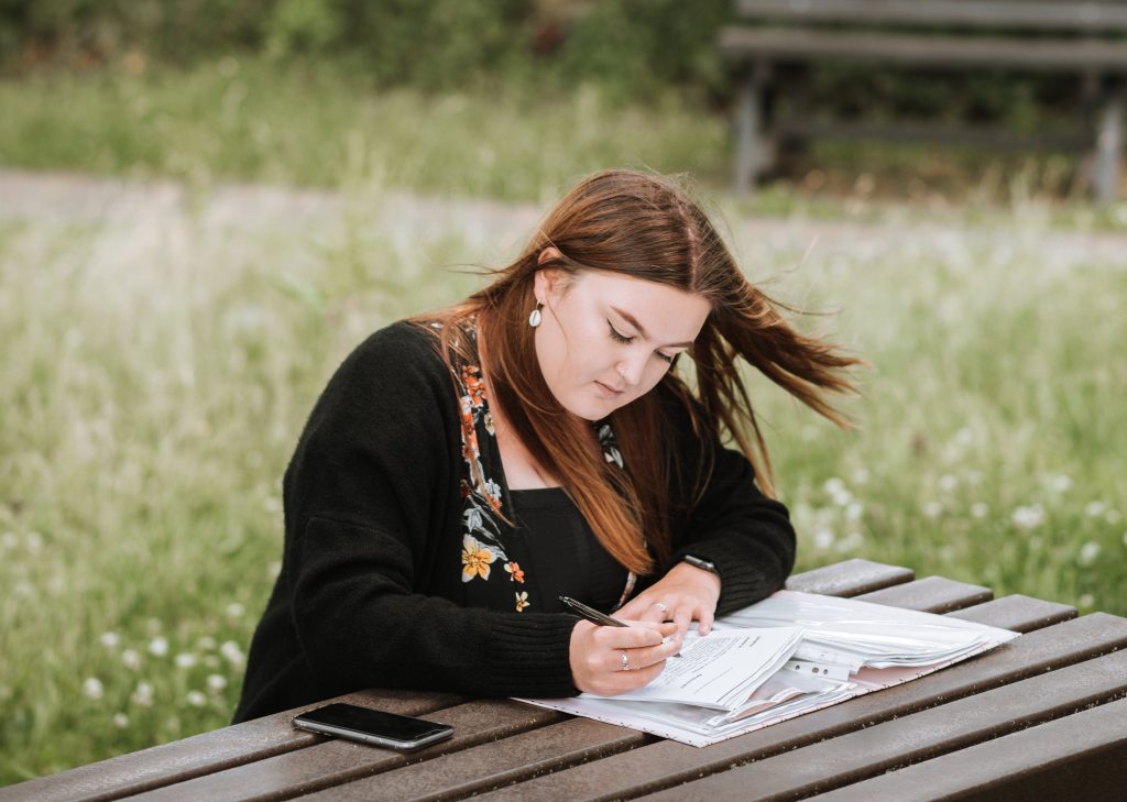 woman studying outside in nature