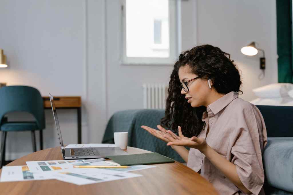 Woman working remotely at home with laptop