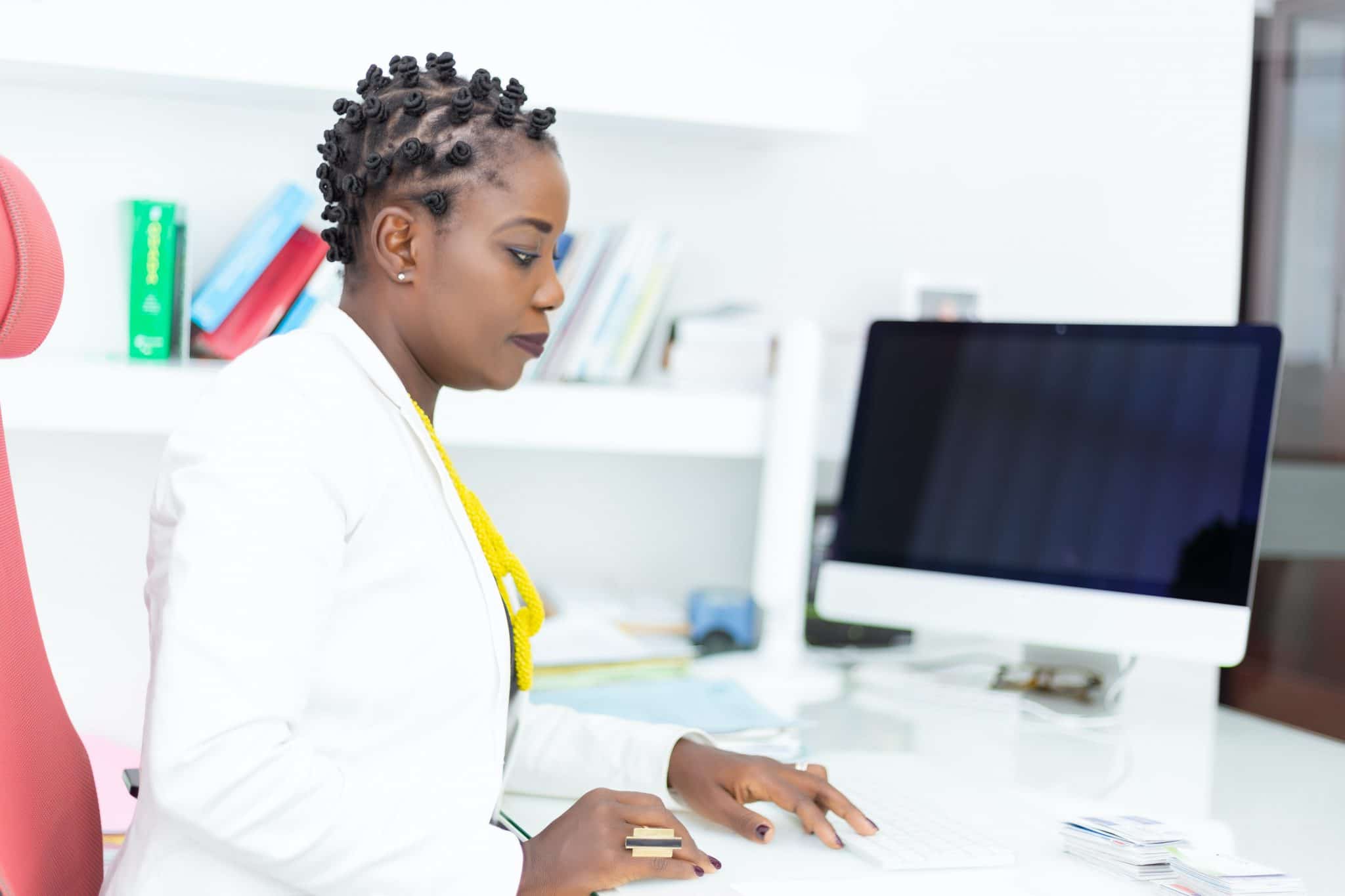 Woman sitting at desk deep work Freedom