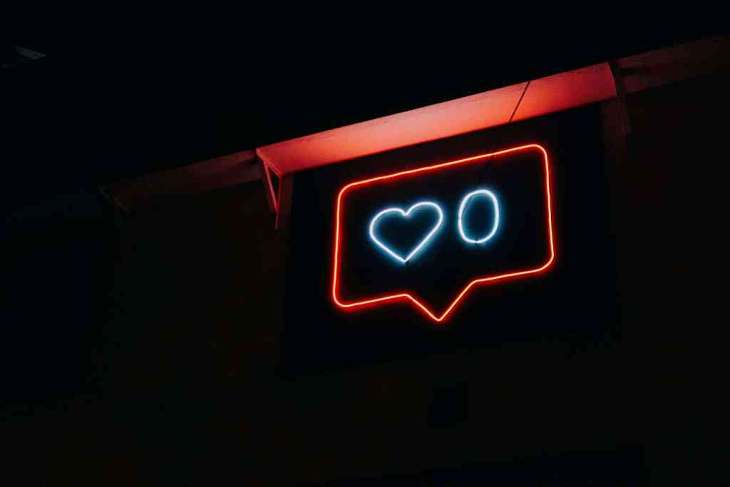 I hate social media! How do I take a break? Neon sign showing 0 likes.